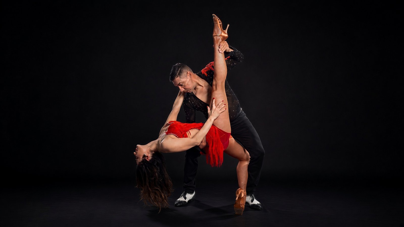 Roberto Arenas Jr. and Maha Zahabi dancing salsa